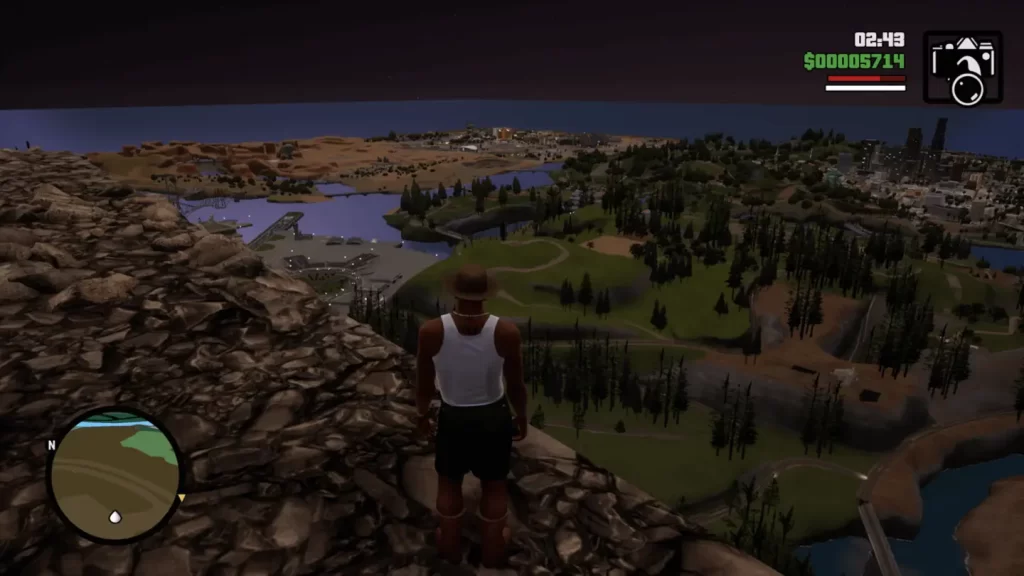 GTA San Andreas Definitive Edition - CJ stojący na górze z widokiem na wyspę i miasto San Andreas