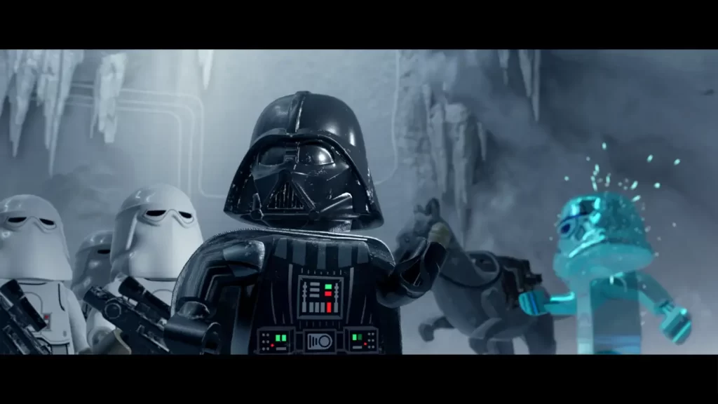 LEGO Star Wars: The Skywalker Saga — screen z gry. Darth Vader wraz ze świtą przemierza wnętrze bazy na Hoth.