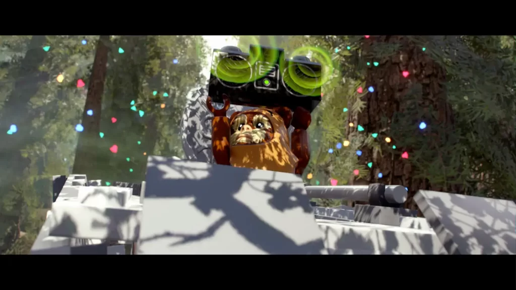 Screen z gry LEGO SW: The Skywalker Saga. Ewok imprezuje na dachu AT-ST.