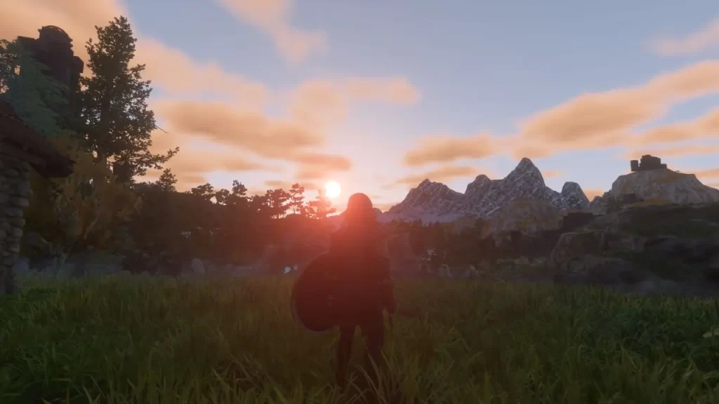 Grafika przedstawia zachód słońca w grze Enshrouded.