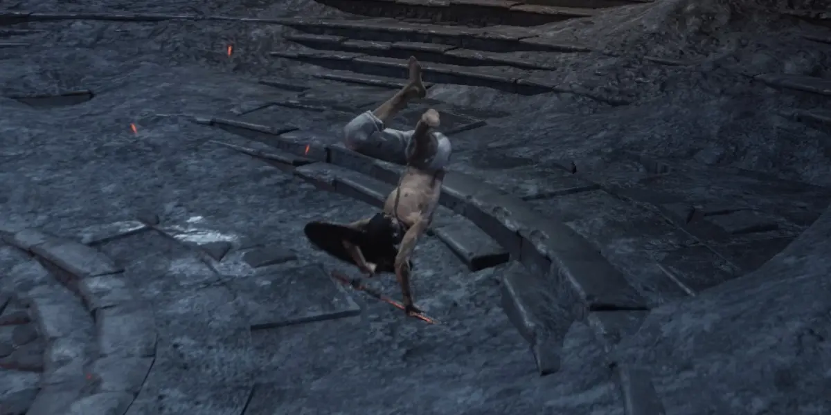 Dark Souls 3 i bohater robiący akrobacje, w tym przypadku staje na rękach