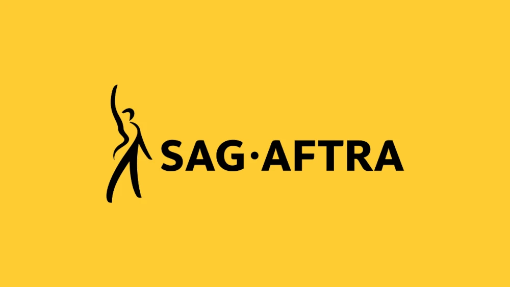 logo SAG-AFTRA na żółtym tle strajk aktorow i aktorek dubbingowych