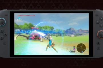 Zrzut ekranu z The Legend of Zelda: Breath of the Wild na Nintendo Switch 2. Link walczy z przeciwnikiem na otwartej łące, używając miecza otoczonego niebieską energią. Na ekranie widoczny interfejs gry z sercami na górze i minimapą w prawym dolnym rogu.