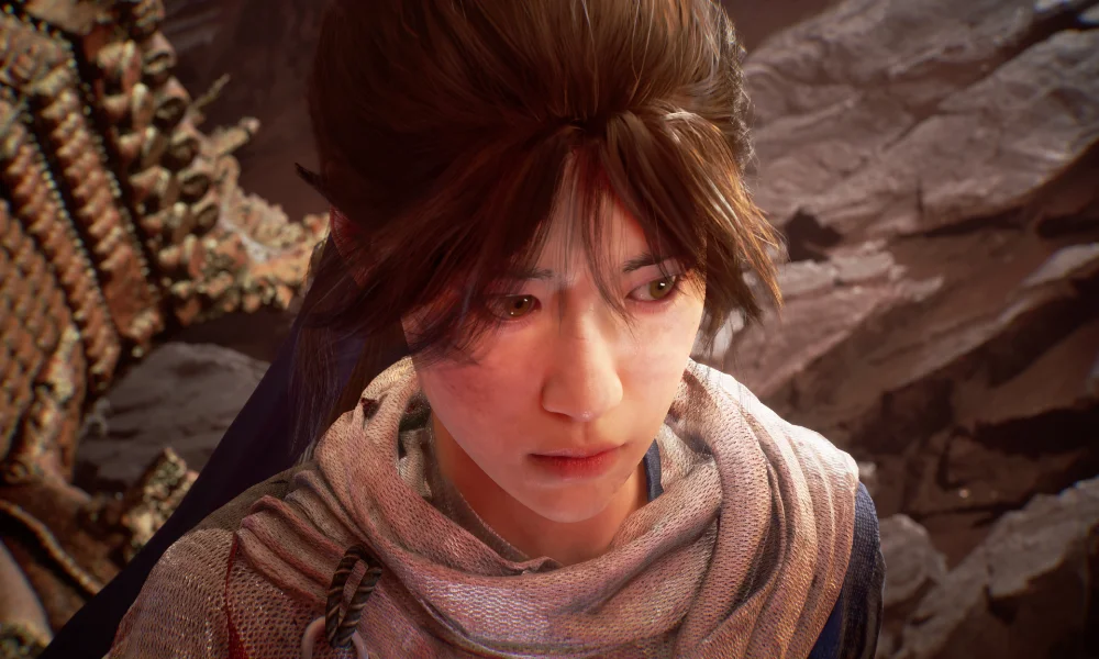 Zbliżenie na twarz Nezhy ukazujące detale postaci i realistyczną oprawę graficzną gry.