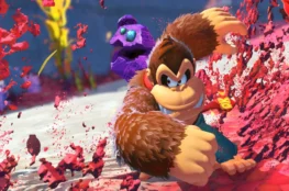 Donkey Kong w dynamicznej scenie akcji, przebijający się przez kolorową, abstrakcyjną przestrzeń w grze Mario Kart World. Jeśli chcesz: