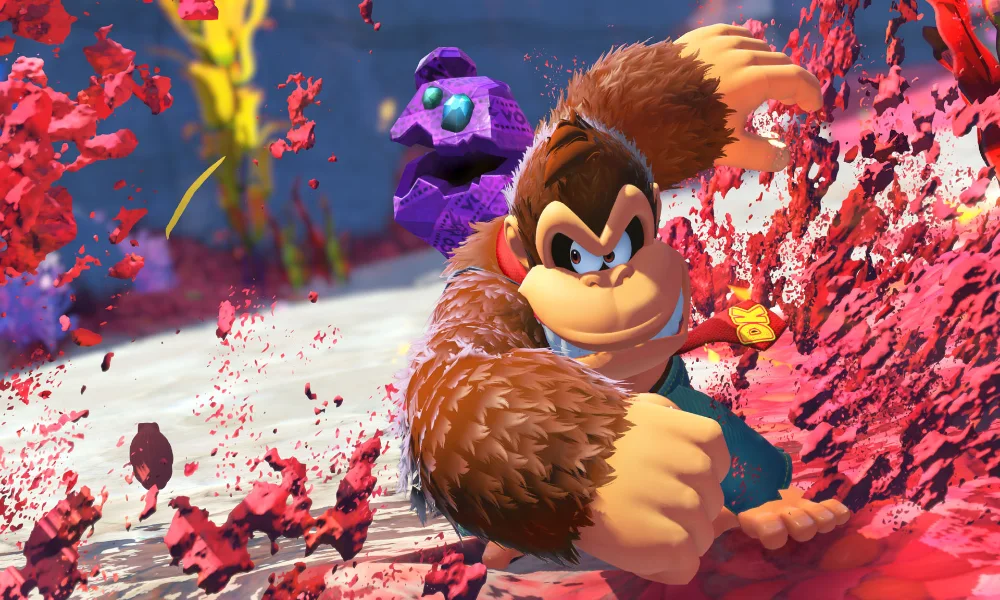 Donkey Kong w dynamicznej scenie akcji, przebijający się przez kolorową, abstrakcyjną przestrzeń w grze Mario Kart World. Jeśli chcesz: