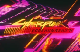 Dynamiczne i pełne neonowych barw logo promujące drugi sezon popularnego serialu anime. W samym centrum kadru wyróżnia się klasyczny, jaskrawożółty napis „Cyberpunk”, pod którym na czerwonym, prostokątnym elemencie umieszczono czarny tytuł „EDGERUNNERS II”.