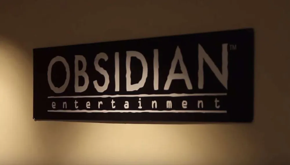 Logo Obsidian Entertainment na ścianie - grafika pod wpis dot. pozwu