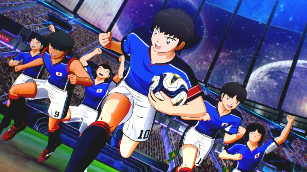Tsubasa Ozora z numerem 10 biegnie z piłką pod pachą, ciesząc się wraz z zawodnikami reprezentacji Japonii na pełnym kibiców stadionie.